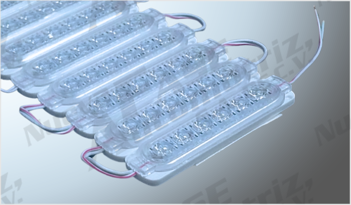 LUZ MODULO "SENCILLO" PLANO C/ADHESIVO 6 LEDS CLAROS 12 Volts (20 PZAS) 10.5x2.7 cms /100